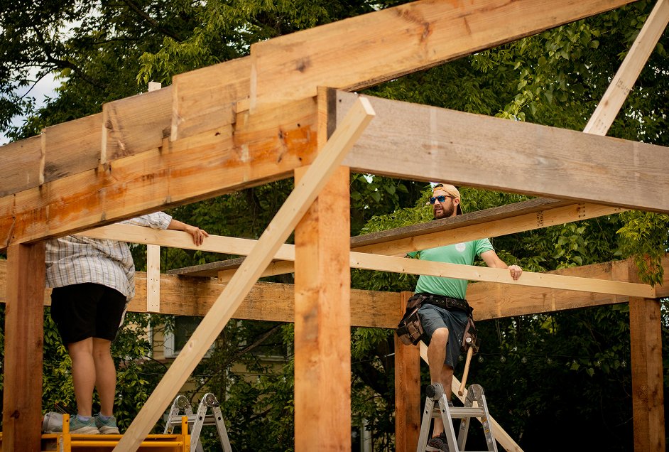 Buildoly carpenter standing inside the wood framing of a Buildoly ADU under construction